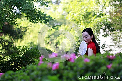 Chinese cheongsam model in Chinese classical garden Stock Photo